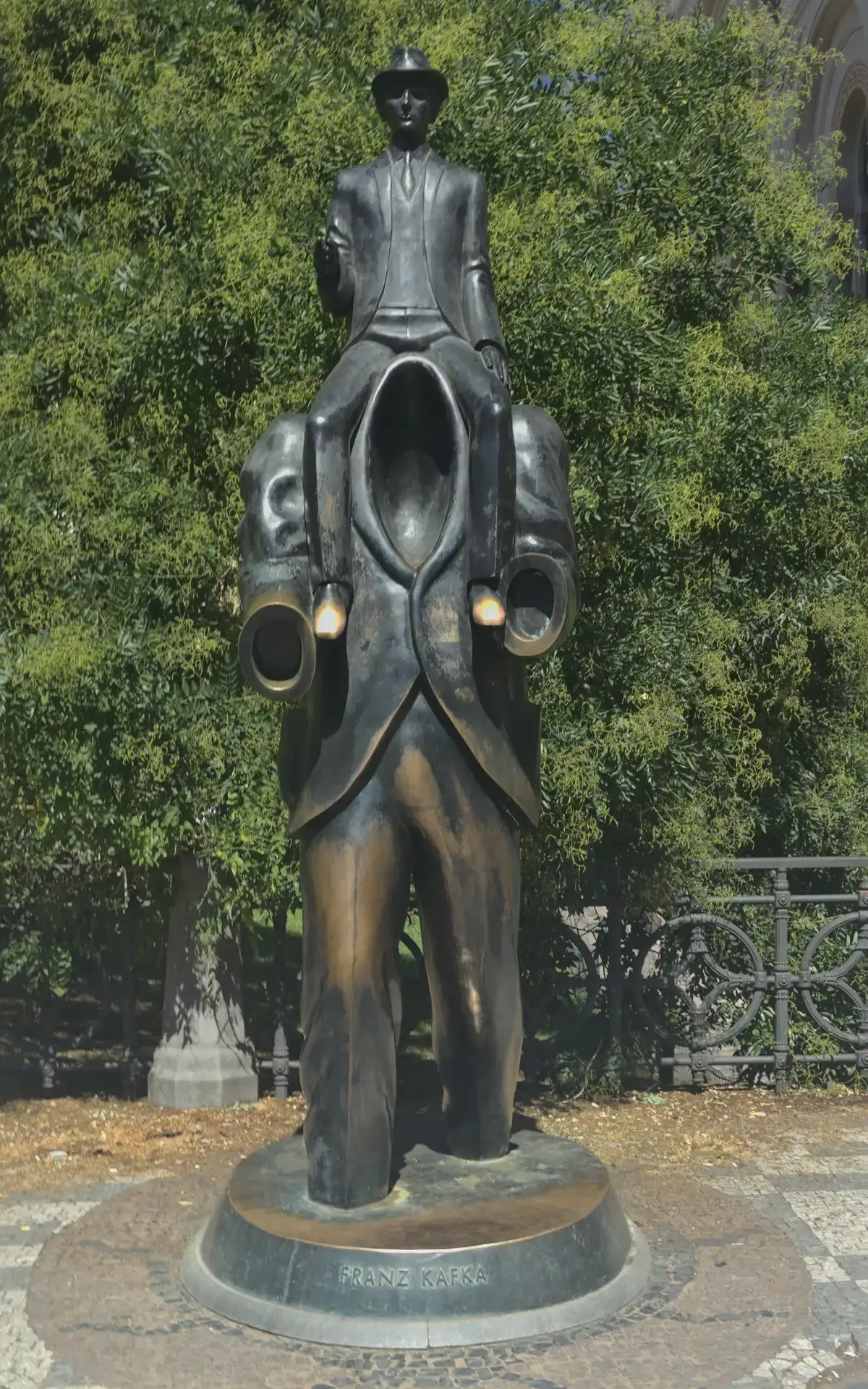 The Franz Kafka monument by Jaroslav Róna on Dušní street beside the Spanish Synagogue, the last stop of a self-guided Prague Jewish Quarter tour