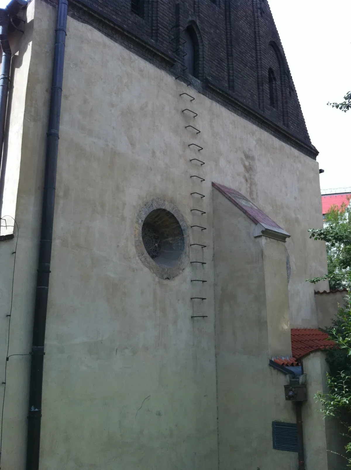 The rear wall of the Old-New Synagogue with the iron rungs to the Golem attic, seen on Prague Jewish Quarter tours