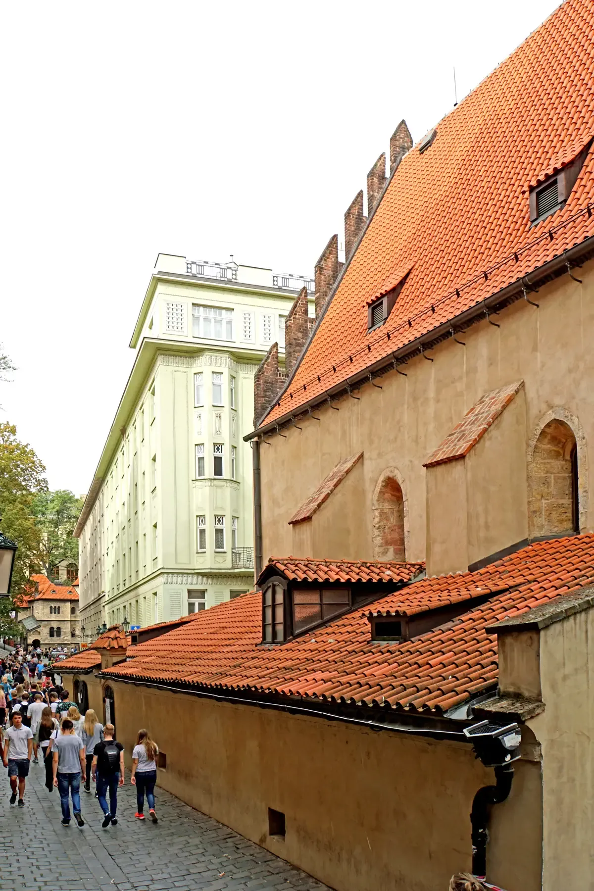 Steep tiled roof of the Old-New Synagogue seen from the street on a Prague Jewish Quarter tour